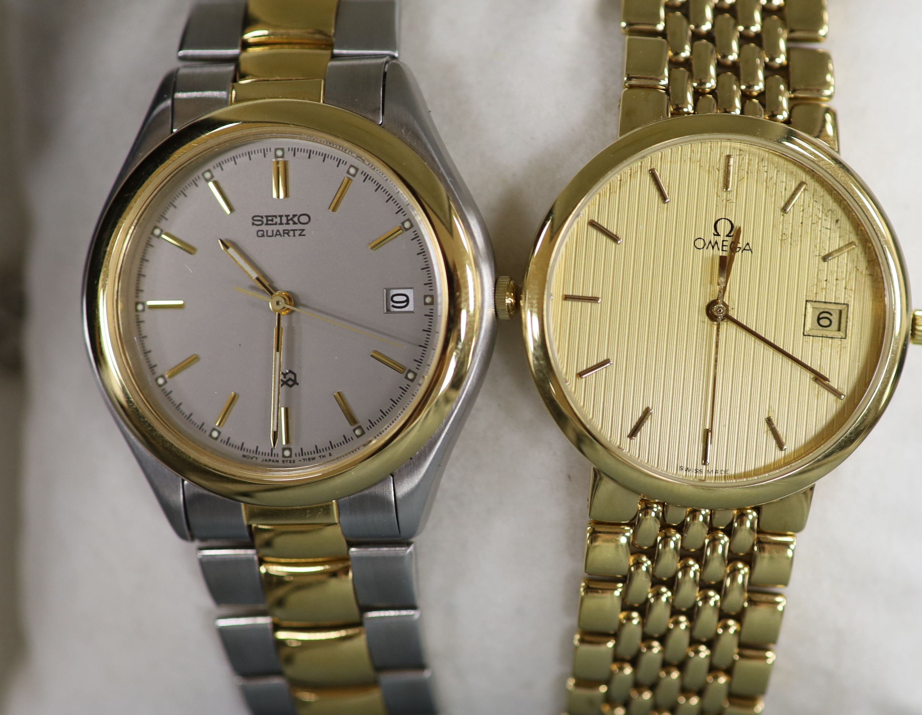 A gentleman's modern steel and gold plated Omega De Ville quartz wrist watch, a Storm watch and a Seiko quartz watch.